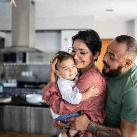 A young family, smiling together